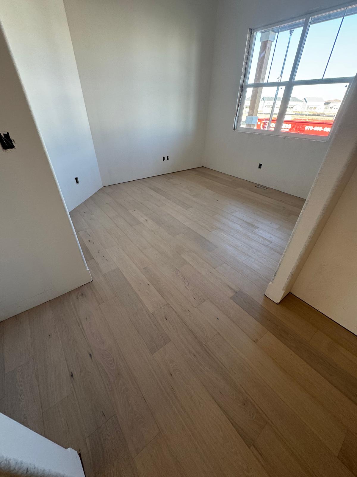 Light hardwood floor installed in a bright room