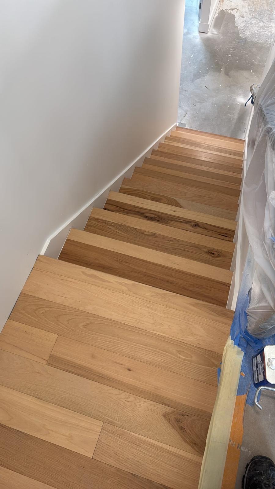 Light oak stair tread installation