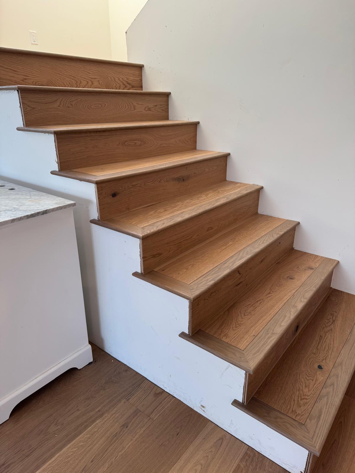 Finished oak stairs with white risers
