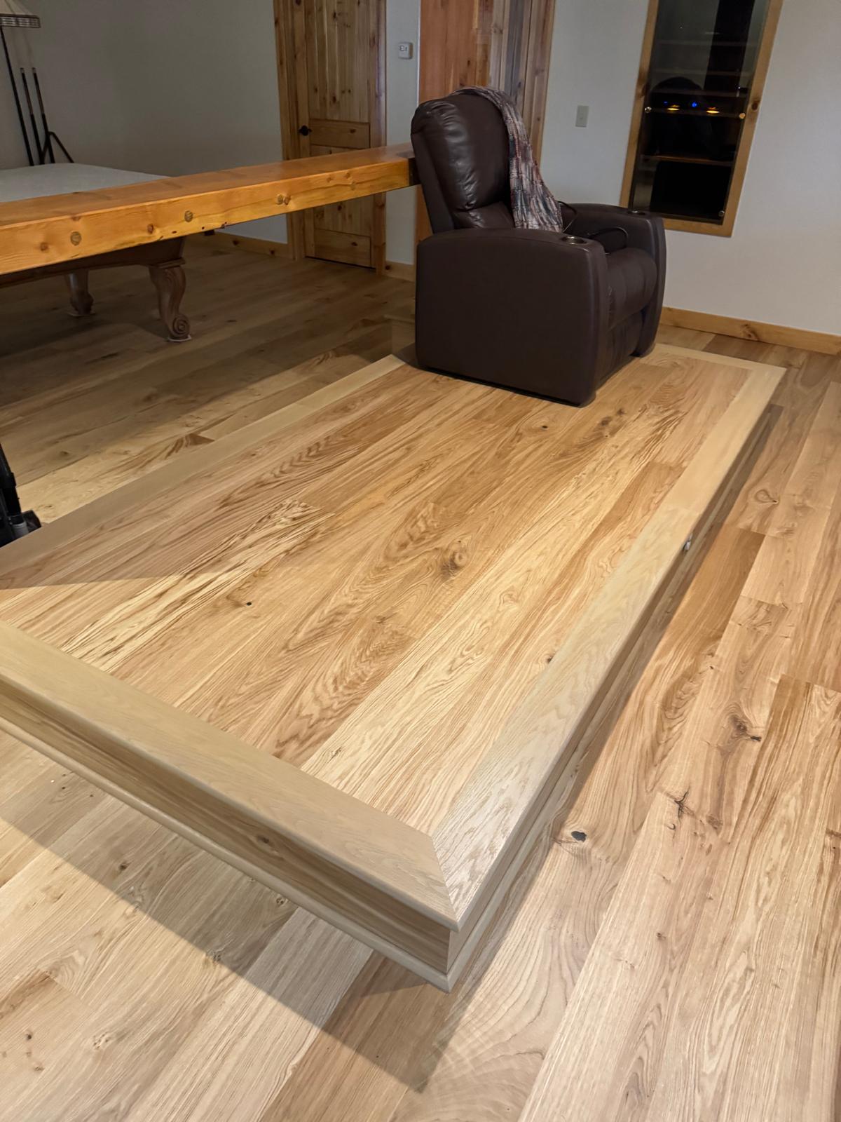 Detailed hardwood platform and trim installation